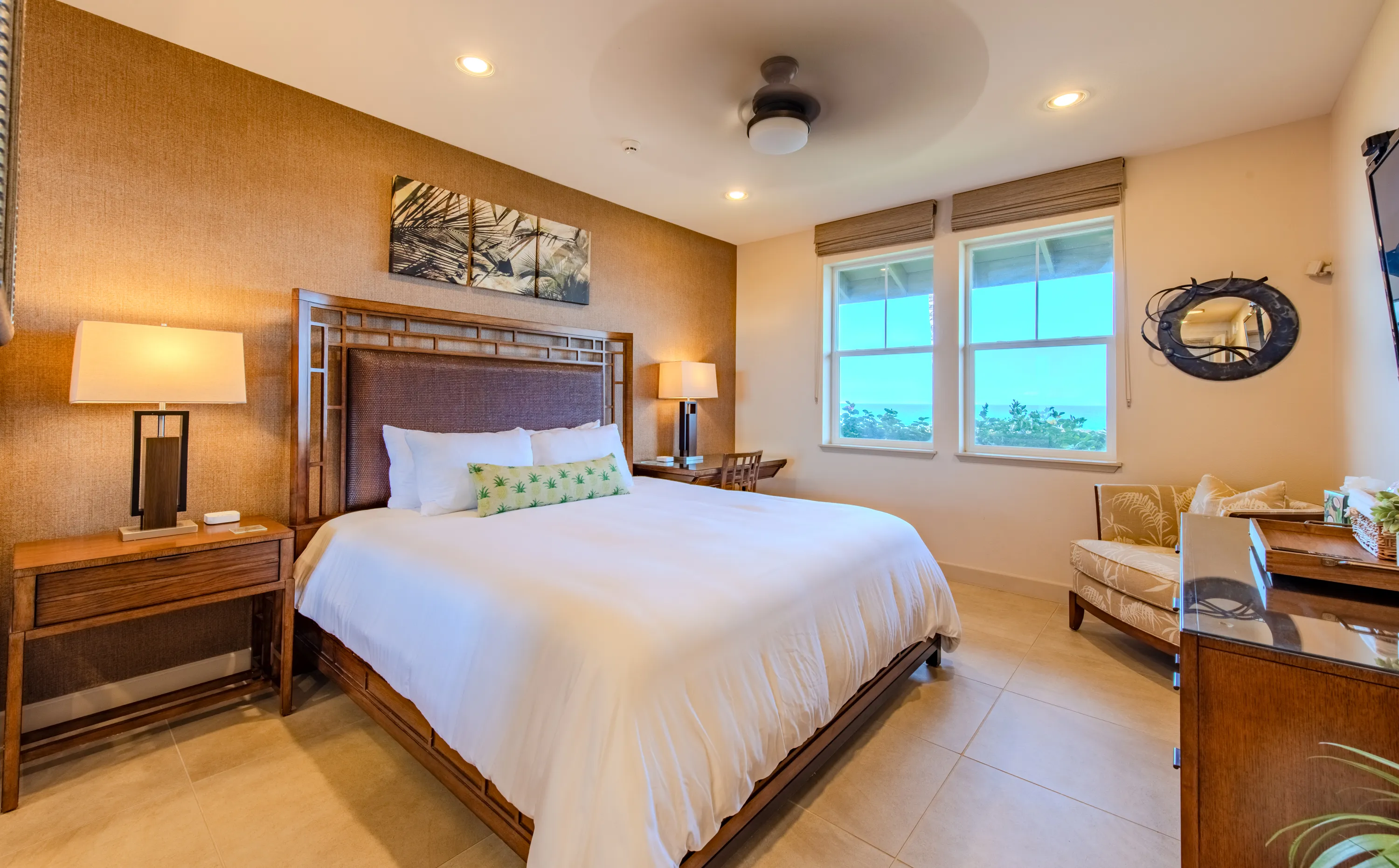 Second bedroom with a king bed and bright windows