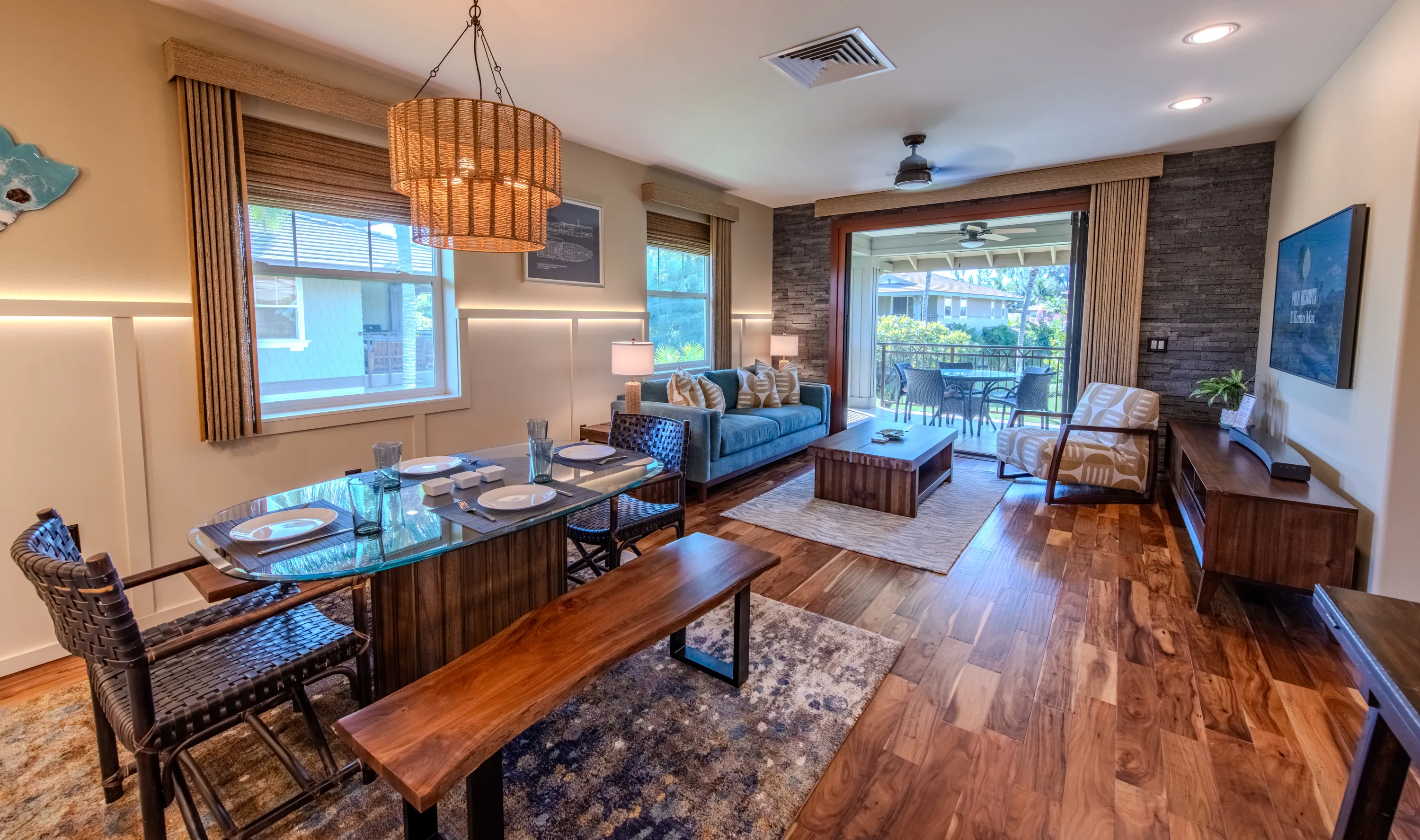Living and dining great room with lounge seating and the lanai beyond