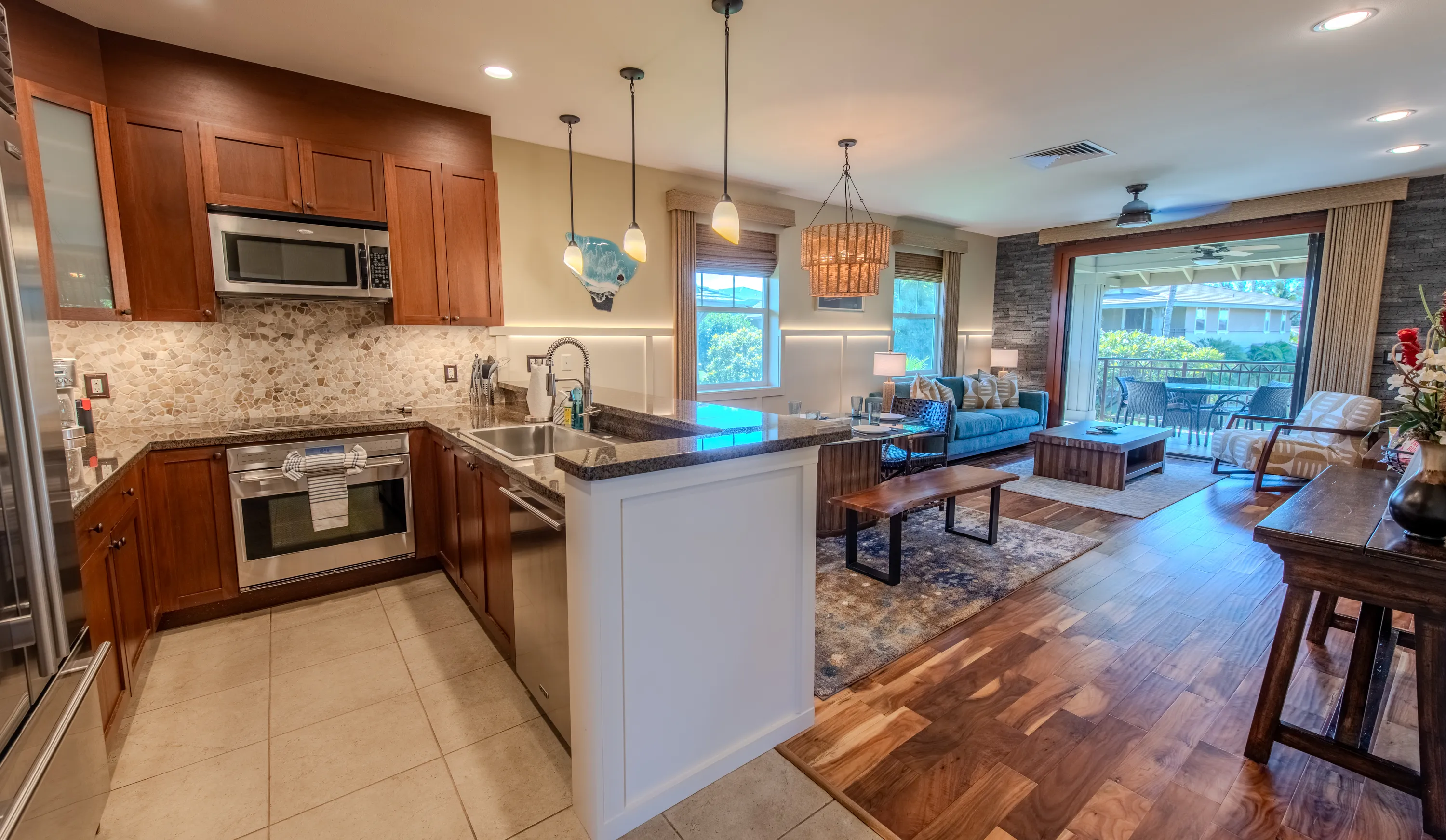 Kitchen and island opening to the living space