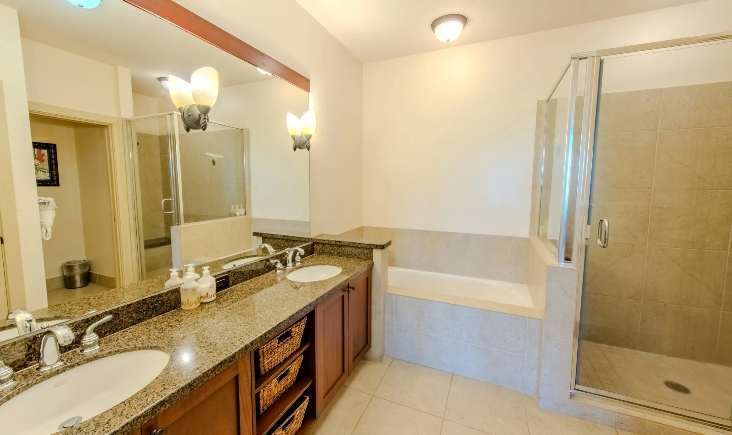 Primary ensuite bathroom with a soaking tub and a separate glass walk-in shower