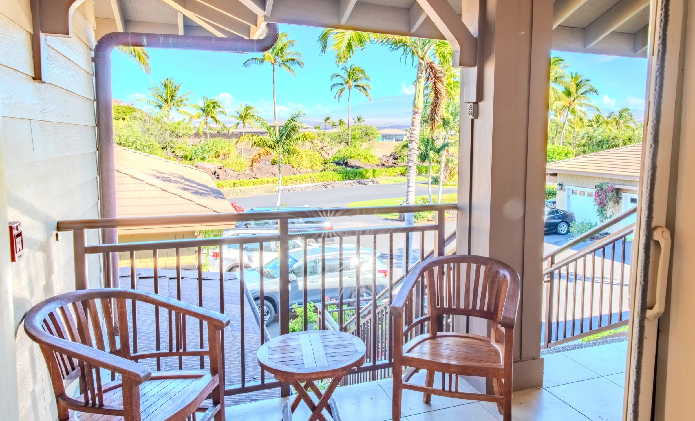 Front lanai with teak seating and views toward the mountains