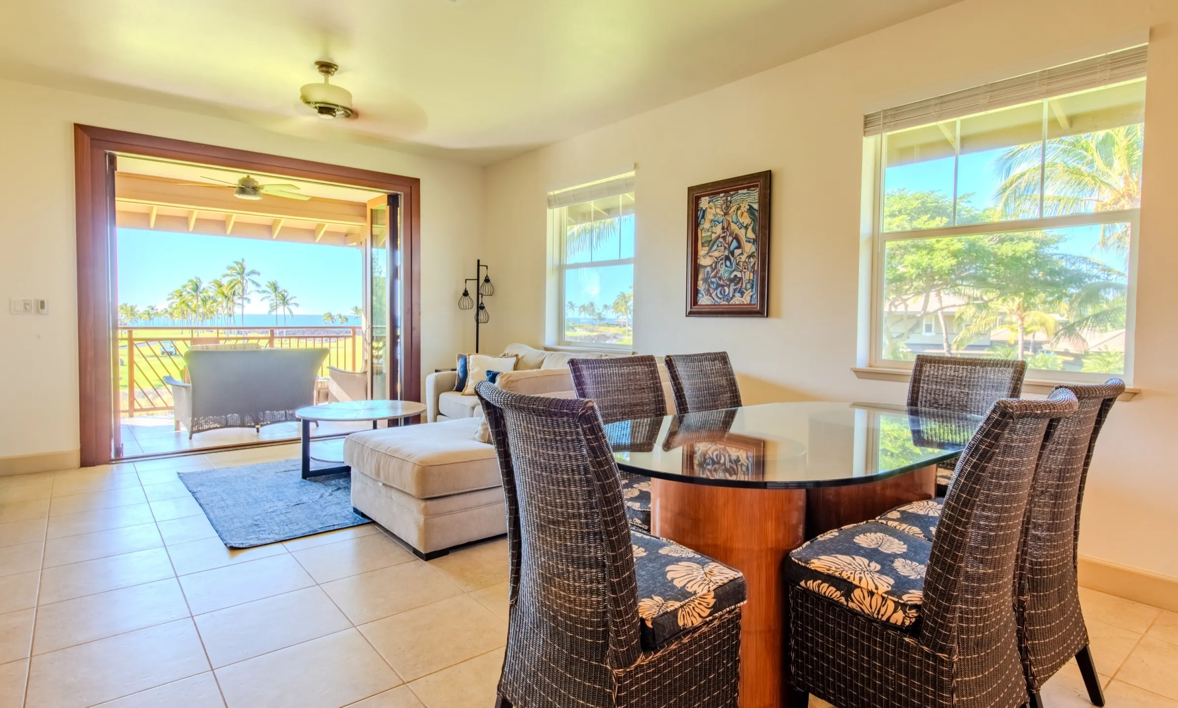 Dining area opening to the covered lanai and the ocean view