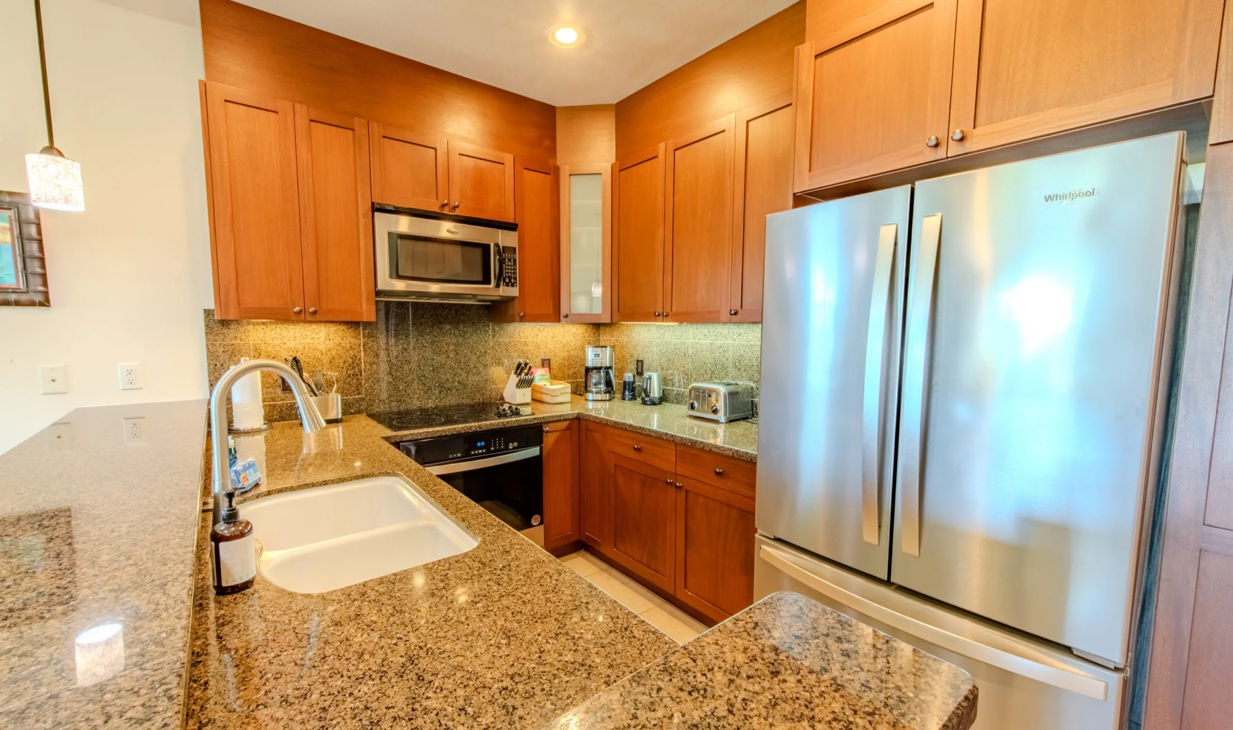 Fully equipped kitchen with granite counters and stainless steel appliances