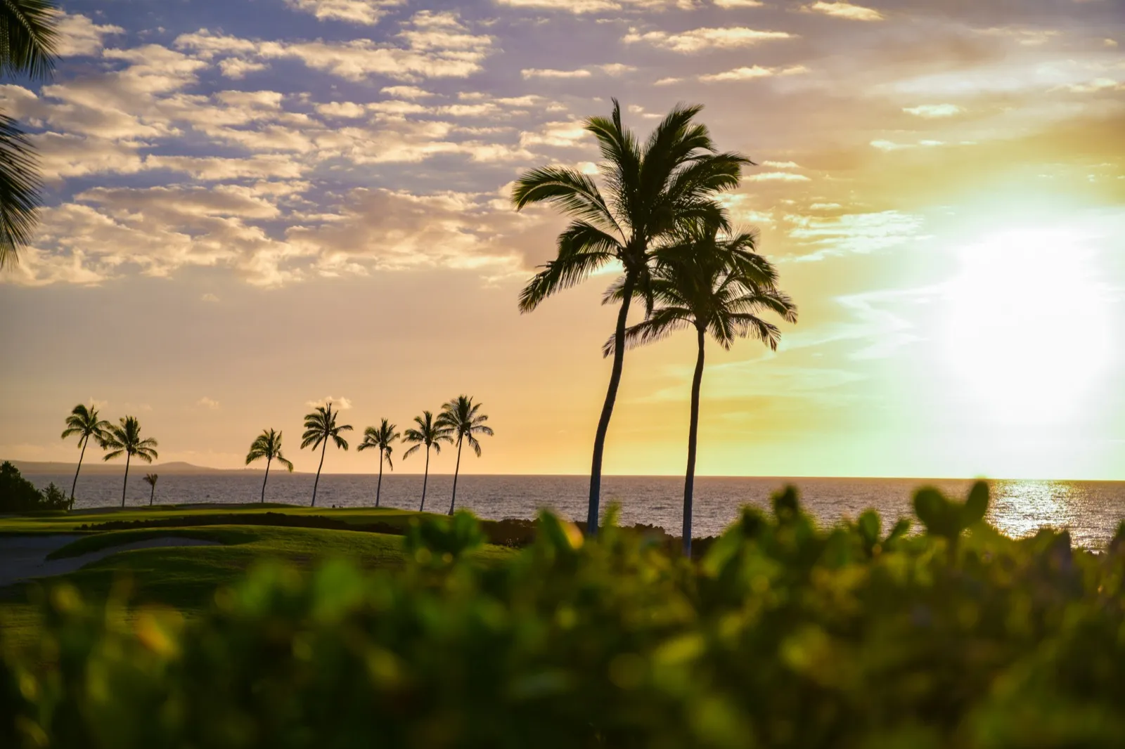Sunset over the lava-rock coastline at Hali'i Kai on the Kohala Coast