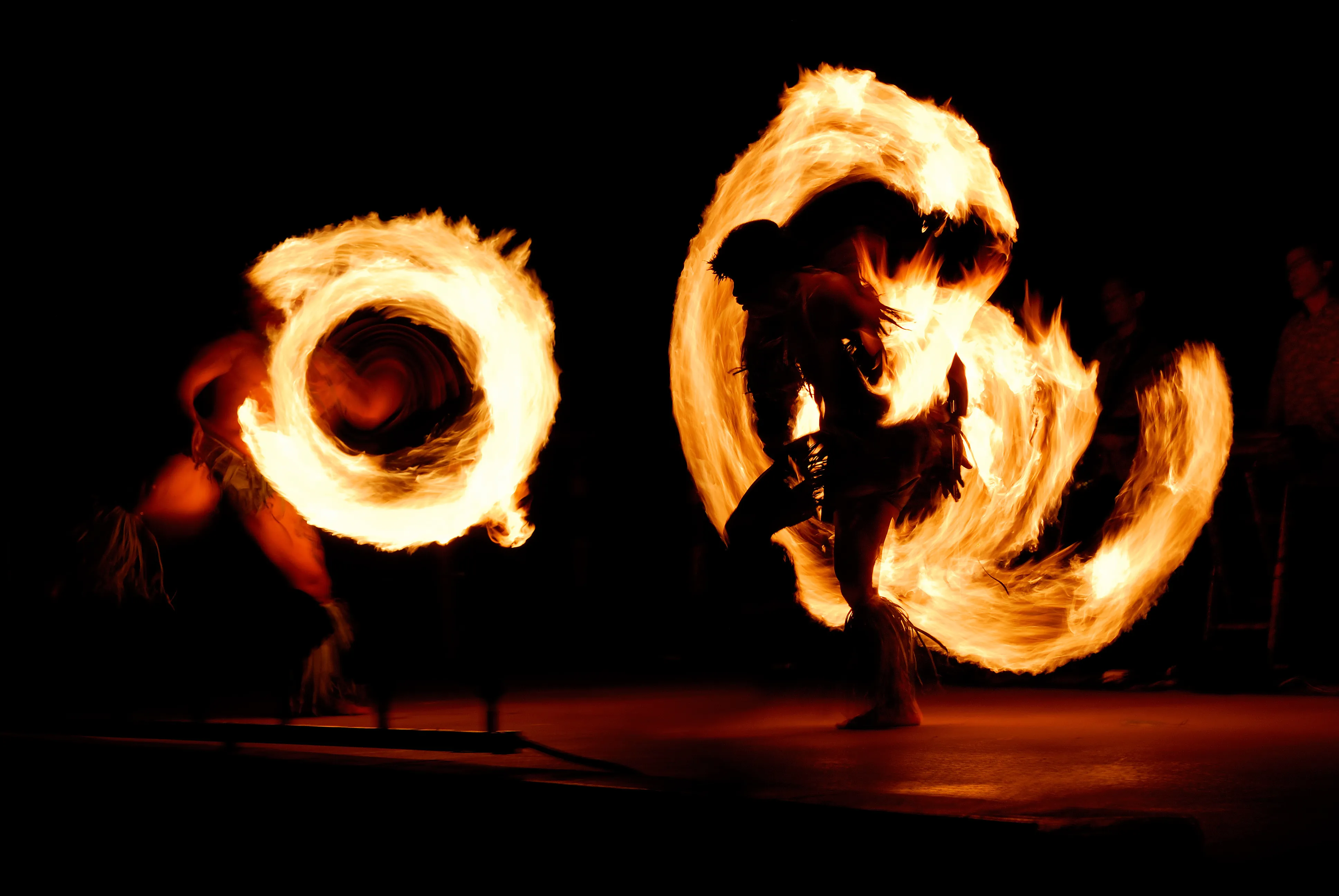 A fire dancer performing at a Kohala Coast luau